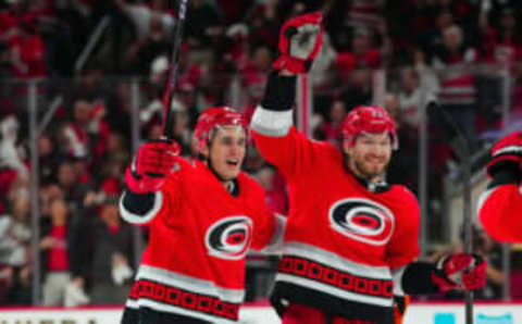 May 3, 2023; Raleigh, North Carolina, USA; Carolina Hurricanes defenseman Brett Pesce (22) celebrates his goal with defenseman Brady Skjei (76) against the New Jersey Devils during the first period in game one of the second round of the 2023 Stanley Cup Playoffs at PNC Arena. Mandatory Credit: James Guillory-USA TODAY Sports