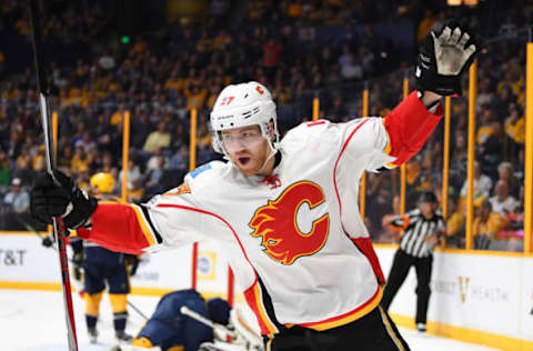 Mar 23, 2017; Nashville, TN, USA; Calgary Flames defenseman Dougie Hamilton (27) celebrates after a goal during the second period against the Nashville Predators at Bridgestone Arena. Mandatory Credit: Christopher Hanewinckel-USA TODAY Sports