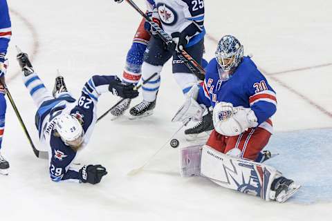 NEW YORK, NY – MARCH 06: New York Rangers goaltender Henrik Lundqvist (30) makes save as Winnipeg Jets right wing Patrik Laine (29) falls near Rangers crease during the Winnipeg Jets and New York Rangers NHL game on March 6, 2018, at Madison Square Garden in New York, NY. (Photo by John Crouch/Icon Sportswire via Getty Images)