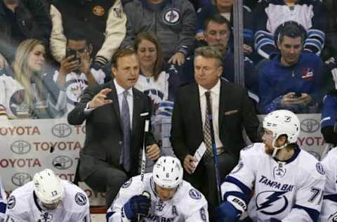 NHL Power Rankings: Tampa Bay Lightning head coach Jon Cooper speaks with assistant Tampa Bay Lightning coach Rick Bowness during the second period against the Winnipeg Jets at the MTS Centre. Mandatory Credit: Bruce Fedyck-USA TODAY Sports