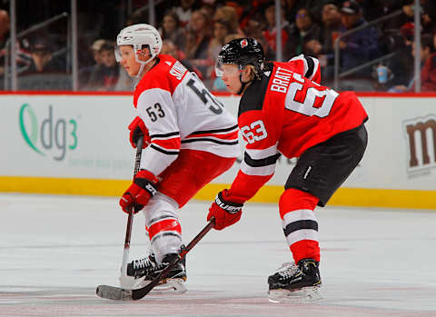 NEWARK, NJ – MARCH 27: Jesper Bratt #63 of the New Jersey Devils in action against Jeff Skinner #53 of the Carolina Hurricanes on March 27, 2018 at Prudential Center in Newark, New Jersey. The Devils defeated the Hurricanes 4-3. (Photo by Jim McIsaac/NHLI via Getty Images)