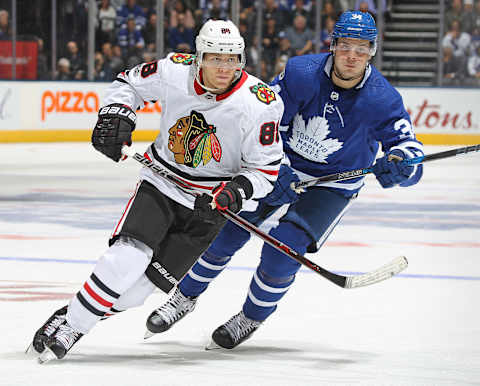 TORONTO, ON – OCTOBER 9: Patrick Kane #88 of the Chicago Blackhawks is shadowed by Auston Matthews #34 of the Toronto Maple Leafs . (Photo by Claus Andersen/Getty Images)