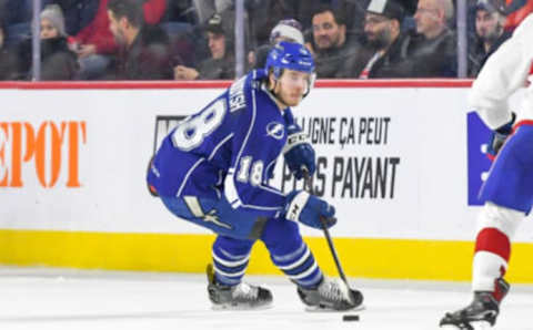 LAVAL, QC, CANADA – DECEMBER 14: Taylor Raddysh #18 of the Syracuse Crunch in control of the puck against the Laval Rocket at Place Bell on December 14, 2018 in Laval, Quebec. (Photo by Stephane Dube /Getty Images)