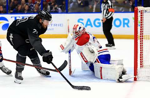 TAMPA, FLORIDA – APRIL 02: Jake Allen #34 of the Montreal Canadiens stops a shot from Brayden Point #21 of the Tampa Bay Lightning in the third period during a game at Amalie Arena on April 02, 2022 in Tampa, Florida. (Photo by Mike Ehrmann/Getty Images)