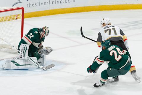 SAINT PAUL, MN – FEBRUARY 11: Alex Stalock #32 makes a save while his Minnesota Wild teammate Matt Dumba #24 defends William Karlsson #71 of the Vegas Golden Knights during the game at the Xcel Energy Center on February 11, 2019 in Saint Paul, Minnesota. (Photo by Bruce Kluckhohn/NHLI via Getty Images)