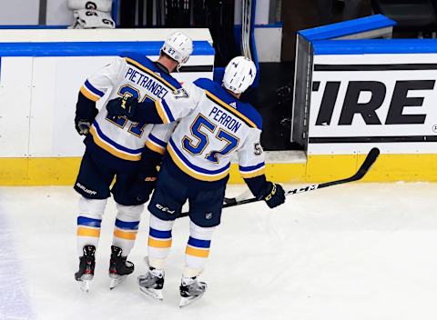 EDMONTON, ALBERTA – AUGUST 21: Alex Pietrangelo #27 and David Perron #57 of the St. Louis Blues leave the ice following a loss to the Vancouver Canucks in Game Six of the Western Conference First Round during the 2020 NHL Stanley Cup Playoffs at Rogers Place on August 21, 2020 in Edmonton, Alberta, Canada. The Canucks defeated the Blues 6-2 to win the Round One playoff series 4-2. (Photo by Jeff Vinnick/Getty Images)