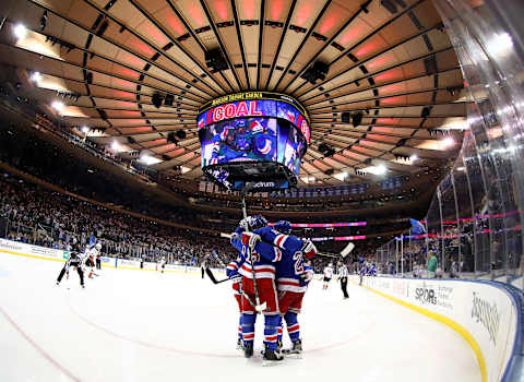 NEW YORK, NEW YORK – DECEMBER 19: The New York Rangers celebrate a goal by Paul Carey