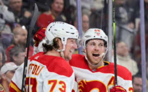 LAS VEGAS, NEVADA – MARCH 16: Tyler Toffoli #73 and Elias Lindholm #28 of the Calgary Flames celebrate Toffoli’s third-period goal against the Vegas Golden Knights during their game at T-Mobile Arena on March 16, 2023 in Las Vegas, Nevada. The Flames defeated the Golden Knights 7-2. (Photo by Ethan Miller/Getty Images)