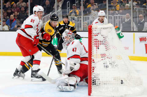 BOSTON, MASSACHUSETTS – DECEMBER 03: Charlie Coyle #13 of the Boston Bruins scores a goal against James Reimer #47 of the Carolina Hurricanes during the third period at TD Garden on December 03, 2019 in Boston, Massachusetts. The Bruins defeat the Hurricanes 2-0. (Photo by Maddie Meyer/Getty Images)