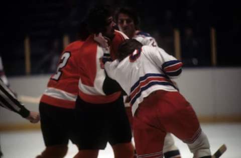 Dave Schultz, Philadelphia Flyers fights and Glen Sather, New York Rangers (Photo by Melchior DiGiacomo/Getty Images)