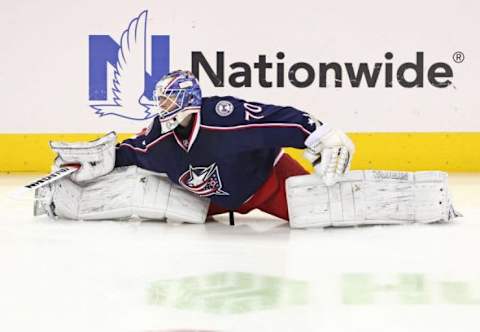 Feb 16, 2016; Columbus, OH, USA; Columbus Blue Jackets goalie Joonas Korpisalo (70) stretches during warmups prior to the game against the Boston Bruins at Nationwide Arena. Mandatory Credit: Aaron Doster-USA TODAY Sports