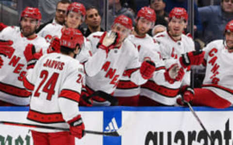 GLOSSARY Apr 23, 2023; Elmont, New York, USA; Carolina Hurricanes center Seth Jarvis (24) celebrates his goal against the New York Islanders with the Carolina Hurricanes bench during the first period in game four of the first round of the 2023 Stanley Cup Playoffs at UBS Arena. Mandatory Credit: Dennis Schneidler-USA TODAY Sports