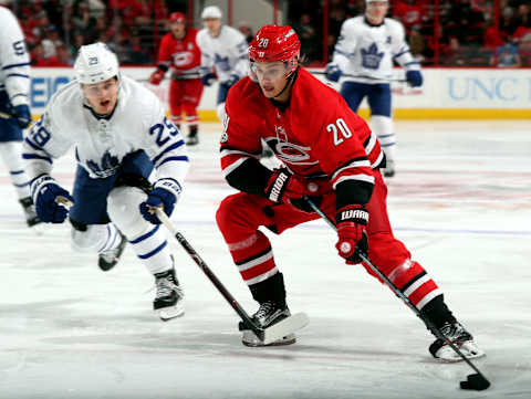 RALEIGH, NC – NOVEMBER 24: Sebastian Aho #20 of the Carolina Hurricanes keeps the puck out of the reach of William Nylander 29 of the Toronto Maple Leafs during an NHL game on November 24, 2017 at PNC Arena in Raleigh, North Carolina. (Photo by Gregg Forwerck/NHLI via Getty Images)