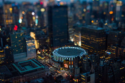 Madison Square Garden (MSG) stands in Manhattan at dusk in this aerial photograph taken with a tilt-shift lens above New York, U.S., on Friday, June 19, 2015. The Standard