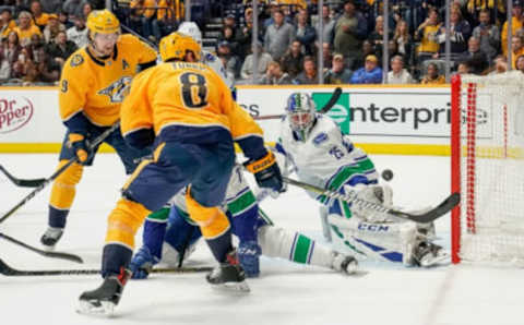 NASHVILLE, TN – APRIL 4: Jacob Markstrom #25 of the Vancouver Canucks makes the save against Kyle Turris #8 of the Nashville Predators at Bridgestone Arena on April 4, 2019 in Nashville, Tennessee. (Photo by John Russell/NHLI via Getty Images)