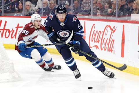 Colorado Avalanche, Ben Meyers (59), Winnipeg Jets, Dylan Samberg (54). Mandatory Credit: James Carey Lauder-USA TODAY Sports