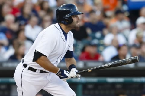 Jun 6, 2014; Detroit, MI, USA; Detroit Tigers catcher Alex Avila (13) hits a single in the fourth inning against the Boston Red Sox at Comerica Park. Mandatory Credit: Rick Osentoski-USA TODAY Sports. MLB.