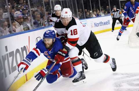 NEW YORK, NEW YORK – APRIL 22: Ondrej Palat #18 of the New Jersey Devils checks Barclay Goodrow #21 of the New York Rangers during Game Three in the First Round of the 2023 Stanley Cup Playoffs at Madison Square Garden on April 22, 2023 in New York, New York. (Photo by Bruce Bennett/Getty Images)