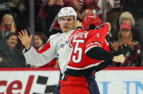 RALEIGH, NC – SEPTEMBER 29: Washington Capitals right wing Garnet Hathaway (21) and Carolina Hurricanes defenseman Roland McKeown (55) fight during an NHL preseason game between the Washington Capitals and the Carolina Hurricanes on September 29, 2019, at the PNC Arena in Raleigh, NC. (Photo by Greg Thompson/Icon Sportswire via Getty Images)