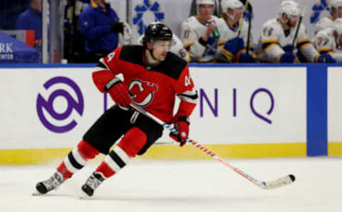 Feb 25, 2021; Buffalo, New York, USA; New Jersey Devils left wing Miles Wood (44) looks for the puck during the third period against the Buffalo Sabres at KeyBank Center. Mandatory Credit: Timothy T. Ludwig-USA TODAY Sports