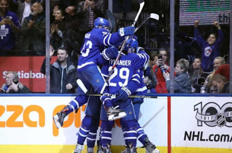 Feb 21, 2017; Toronto, Ontario, CAN; Toronto Maple Leafs defenseman Jake Gardiner (51) is congratulated by center Nazem Kadri (43) and center William Nylander (29) and center Auston Matthews (34) against the Winnipeg Jets at Air Canada Centre. The Maple Leafs beat the Jets 5-4 in overtime. Mandatory Credit: Tom Szczerbowski-USA TODAY Sports