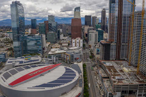 LOS ANGELES, CALIFORNIA – MARCH 20: Staples Center and downtown high-rise buildings are seen after the new restrictions went into effect at midnight as the coronavirus pandemic spreads on March 20, 2020 in Los Angeles, California. California Governor Gavin Newsom issued a statewide stay at home order for Californias 40 million residents except for necessary activities in order to slow the spread of COVID-19. (Photo by David McNew/Getty Images)