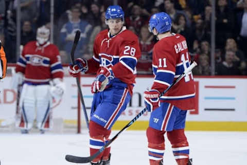 NHL Power Rankings: Montreal Canadiens defenseman Nathan Beaulieu (28) reacts with teammate Montreal Canadiens forward Brendan Gallagher (11) after scoring a goal against the Vancouver Canucks during the second period at the Bell Centre. Mandatory Credit: Eric Bolte-USA TODAY Sports