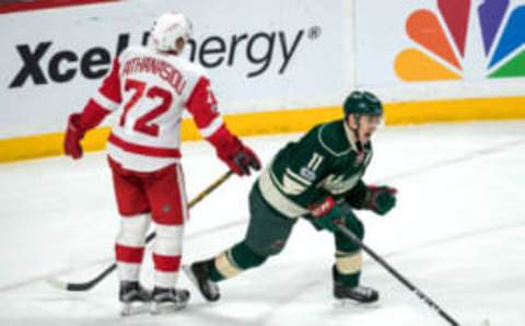 Feb 12, 2017; Saint Paul, MN, USA; Minnesota Wild forward Zach Parise (11) celebrates his goal in front of Detroit Red Wings forward Andreas Athanasiou (72) during the third period at Xcel Energy Center. The Wild defeated the Red Wings 6-3. Mandatory Credit: Brace Hemmelgarn-USA TODAY Sports