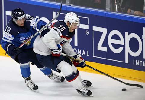 COLOGNE, GERMANY – MAY 18, 2017: Finland’s Veli-Matti Savinainen (L) and the United States’ Brady Skjei fight for the pcuk in their 2017 IIHF World Championship quarterfinal ice hockey match at Lanxess Arena. Anton Novoderezhkin/TASS (Photo by Anton Novoderezhkin\TASS via Getty Images)