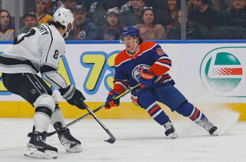 Mar 30, 2023; Edmonton, Alberta, CAN; Edmonton Oilers forward Kailer Yamamoto (56) looks to make a pass in front of Los Angeles Kings defensemen Drew Doughty (8) during the first period at Rogers Place. Mandatory Credit: Perry Nelson-USA TODAY Sports