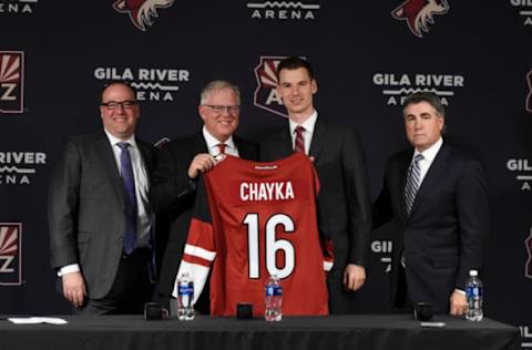 PHOENIX, AZ – MAY 05: President and CEO Anthony LeBlanc of the Arizona Coyotes (from left to right), President of Hockey Operations Gary Drummond, GM John Chayka and Executive Vice President and Head Coach Dave Tippett pose for a photo during a press conference introducing Chayka as the Coyotes new GM at Gila River Arena on May 05, 2016 in Phoenix, Arizona. (Photo by Norm Hall/NHLI via Getty Images)