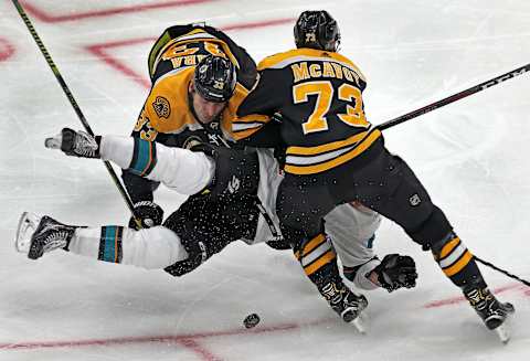 BOSTON – FEBRUARY 26: Boston Bruins defensemen Zdeno Chara (33) and Charlie McAvoy (73) combine to level the Sharks’ Timo Meier in the second period. The Boston Bruins host the San Jose Sharks in a regular season NHL hockey game at TD Garden in Boston on Feb. 26, 2019. (Photo by Jim Davis/The Boston Globe via Getty Images)