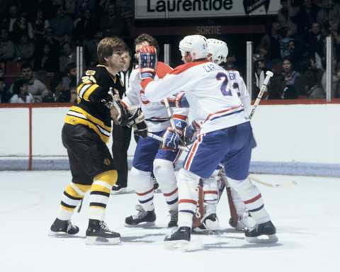 MONTREAL 1990’s: Terry O’Reilly #24 of the Boston Bruins skates against Kent Carlson #2 of the Montreal Canadiens in the 1980’s at the Montreal Forum in Montreal, Quebec, Canada. (Photo by Denis Brodeur/NHLI via Getty Images)