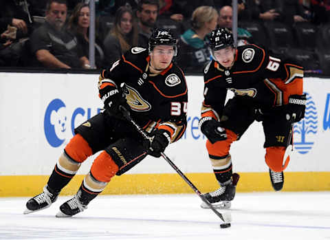 Sam Steel #34 of the Anaheim Ducks breaks out with Troy Terry #61 (Photo by Harry How/Getty Images)