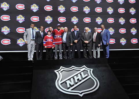 Jun 26, 2015; Sunrise, FL, USA; Noah Juulsen on stage with team executives after being selected as the number twenty-six overall pick to the Montreal Canadiens in the first round of the 2015 NHL Draft at BB&T Center. Mandatory Credit: Steve Mitchell-USA TODAY Sports