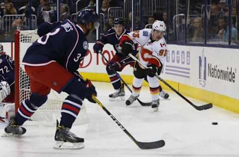 Nov 23, 2016; Columbus, OH, USA; Calgary Flames center Sam Bennett (93) passes the puck as Columbus Blue Jackets defenseman Seth Jones (3) defends during the first period at Nationwide Arena. Mandatory Credit: Russell LaBounty-USA TODAY Sports