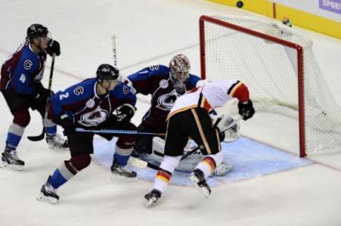 Nov 3, 2015; Denver, CO, USA;Calgary Flames center Sam Bennett (93) attempts to score past Colorado Avalanche goalie Semyon Varlamov (1) and defenseman Nick Holden (2) and defenseman Tyson Barrie (4) in the third period at Pepsi Center. The Avalanche defeated the Flames 6-3. Mandatory Credit: Ron Chenoy-USA TODAY Sports