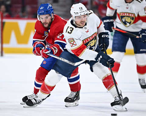 MONTREAL, CANADA – MARCH 30: Sam Reinhart #13 of the Florida Panthers skates the puck against Jonathan Drouin #27 of the Montreal Canadiens during the third period at Centre Bell on March 30, 2023 in Montreal, Quebec, Canada. The Florida Panthers defeated the Montreal Canadiens 5-2. (Photo by Minas Panagiotakis/Getty Images)