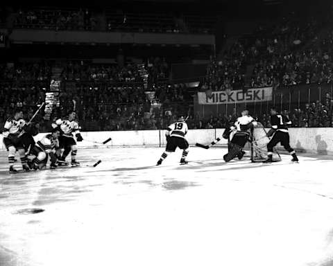 NEW YORK – 1951: Ted Lindsay #7 of the Detroit Red Wings tries to score in front of the New York Rangers net (Photo by Bruce Bennett Studios via Getty Images Studios/Getty Images)