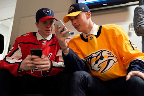 VANCOUVER, BRITISH COLUMBIA – JUNE 21: (L-R) Connor Mcmichael, twenty-fifth overall by the Washington Capitals and Philip Tomasino, twenty-fourth overall by the Nashville Predators talk during the first round of the 2019 NHL Draft at Rogers Arena on June 21, 2019 in Vancouver, Canada. (Photo by Rich Lam/Getty Images)