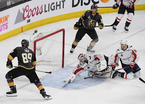 LAS VEGAS, NV – MAY 30: Braden Holtby #70 of the Washington Capitals makes a diving stick save on a shot by Alex Tuch #89 of the Vegas Golden Knights as John Carlson #74 of the Capitals defends in the third period of Game Two of the 2018 NHL Stanley Cup Final at T-Mobile Arena on May 30, 2018 in Las Vegas, Nevada. The Capitals defeated the Golden Knights 3-2. (Photo by Ethan Miller/Getty Images)