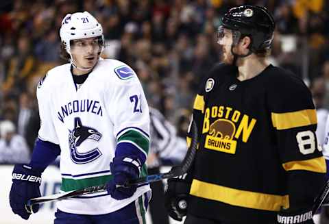 BOSTON, MA – FEBRUARY 11: Loui Eriksson #21 of the Vancouver Canucks talks with Kevan Miller #86 of the Boston Bruins during the second period at TD Garden on February 11, 2017 in Boston, Massachusetts. (Photo by Maddie Meyer/Getty Images)