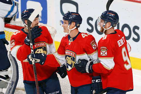 SUNRISE, FL – APRIL 15: Gustav Forsling #42 celebrates his goal with Sam Reinhart #13 and Sam Bennett #9 of the Florida Panthers against the Winnipeg Jets at the FLA Live Arena on April 15, 2022 in Sunrise, Florida. (Photo by Joel Auerbach/Getty Images)