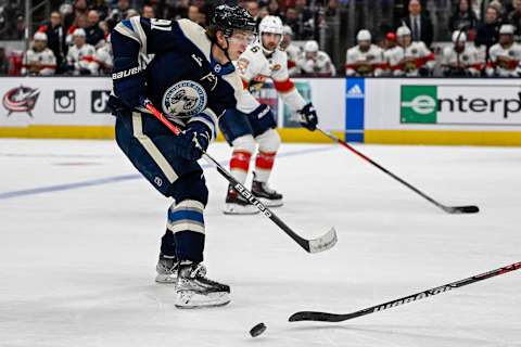 Nov 20, 2022; Columbus, Ohio, USA; Columbus Blue Jackets center Kent Johnson (91) passes the puck in the third period against the Florida Panthers at Nationwide Arena. Mandatory Credit: Gaelen Morse-USA TODAY Sports