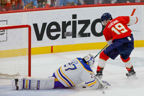 Apr 4, 2023; Sunrise, Florida, USA; Buffalo Sabres goaltender Devon Levi (27) makes a save after a shot from Florida Panthers left wing Matthew Tkachuk (19) during the third period at FLA Live Arena. Mandatory Credit: Sam Navarro-USA TODAY Sports