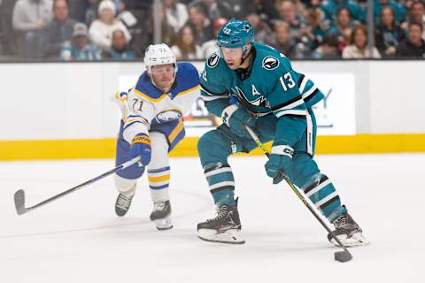 Feb 18, 2023; San Jose, California, USA; San Jose Sharks center Nick Bonino (13) controls the puck during the second period against Buffalo Sabres left wing Victor Olofsson (71) at SAP Center at San Jose. Mandatory Credit: Stan Szeto-USA TODAY Sports