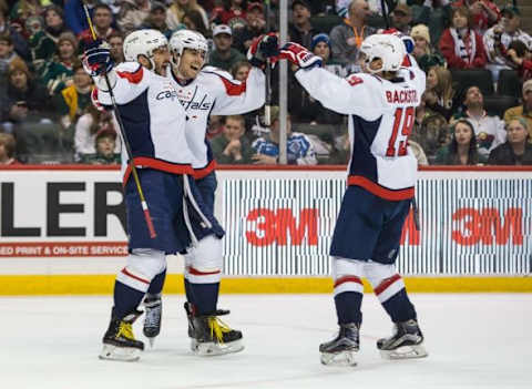 Feb 11, 2016; Saint Paul, MN, USA; Washington Capitals forward Alex Ovechkin (8) celebrates his third goal of the game with defenseman Matt Niskanen (2) and forward Nicklas Backstrom (19) during the second period against the Minnesota Wild at Xcel Energy Center. Mandatory Credit: Brace Hemmelgarn-USA TODAY Sports