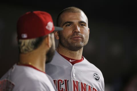 MIAMI, FLORIDA – AUGUST 29: Joey Votto #19 of the Cincinnati Reds talks with Eugenio Suarez #7 against the Miami Marlins at Marlins Park on August 29, 2019 in Miami, Florida. (Photo by Michael Reaves/Getty Images)