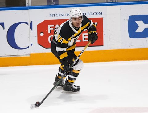 Flyers prospect Zayde Wisdom in action for the Kingston Frontenacs. (Photo by Chris Tanouye/Getty Images)