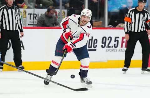 Jan 24, 2023; Denver, Colorado, USA; Washington Capitals left wing Conor Sheary (73) shoots the puck in the third period against the Colorado Avalanche at Ball Arena. Mandatory Credit: Ron Chenoy-USA TODAY Sports